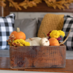 image of mums, pumpkins and gourds on a coffee table for fall décor